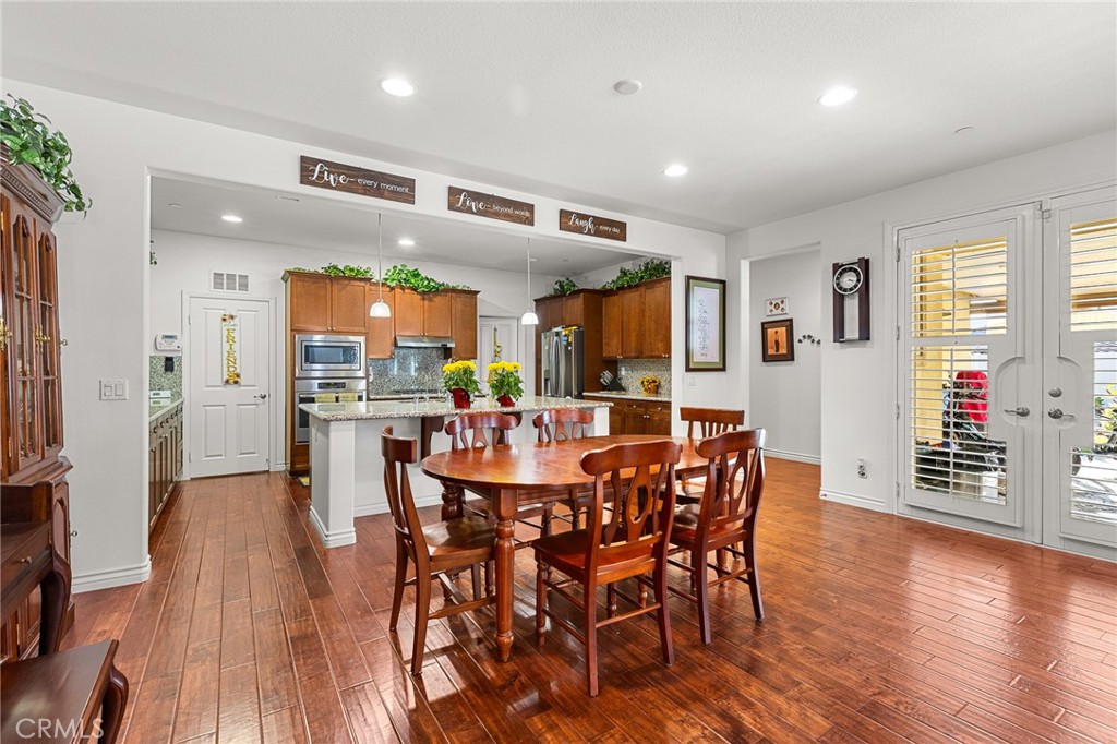 1575 North Grove Street Redlands, CA 92374 - Photo 12 of 45 a view of a dining room with furniture window and wooden floor