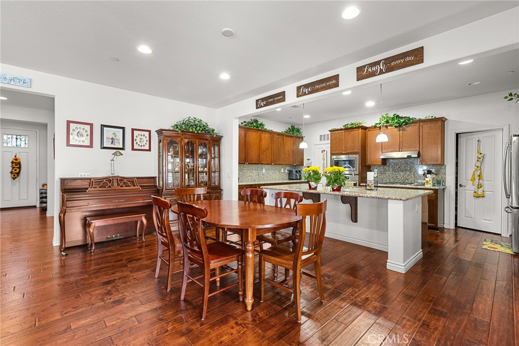 1575 North Grove Street Redlands, CA 92374 - Photo 13 of 45 a view of a dining room with furniture and wooden floor