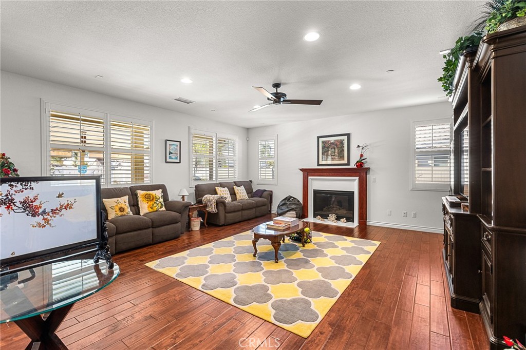 1575 North Grove Street Redlands, CA 92374 - Photo 16 of 45 a living room with furniture large window and a fireplace