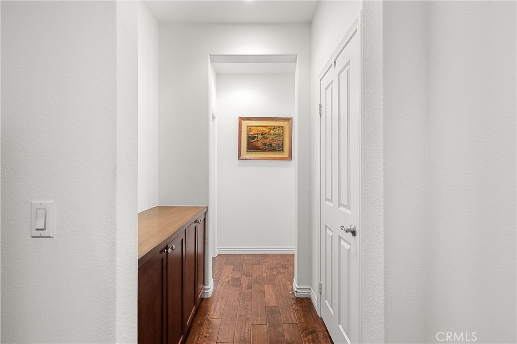 1575 North Grove Street Redlands, CA 92374 - Photo 17 of 45 a view of a hallway with wooden floor