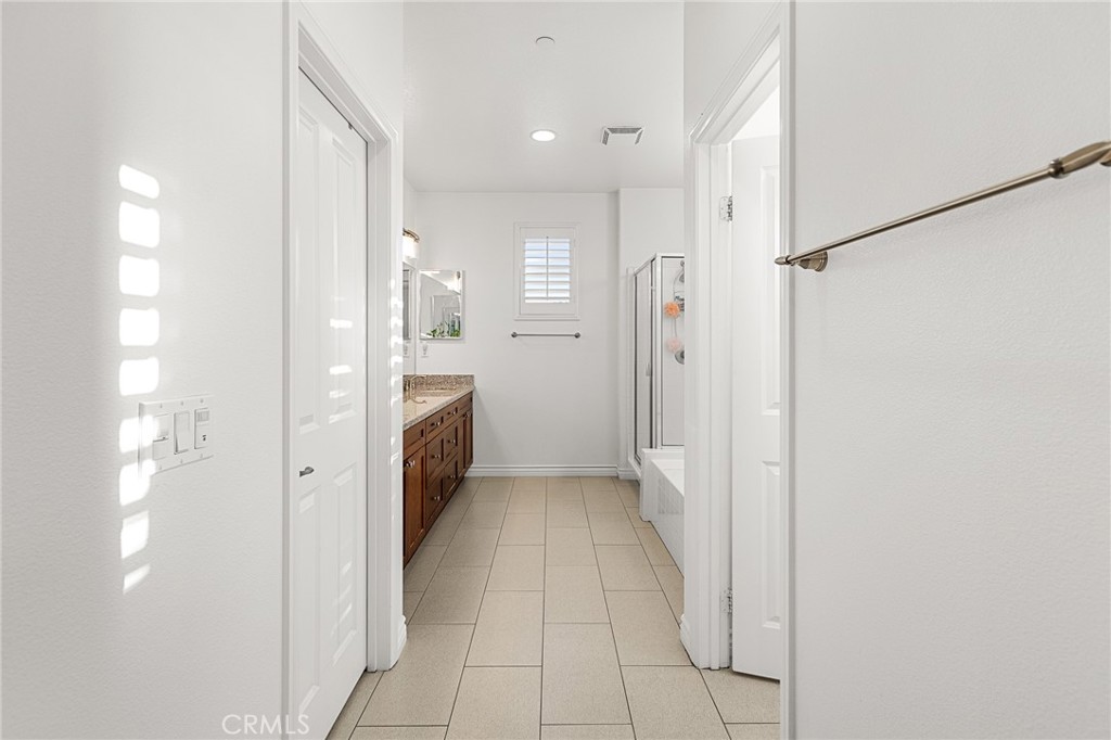 1575 North Grove Street Redlands, CA 92374 - Photo 22 of 45 a bathroom with a double vanity sink and a mirror