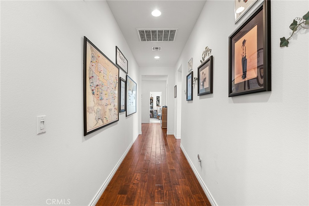 1575 North Grove Street Redlands, CA 92374 - Photo 23 of 45 a view of a hallway with wooden floor