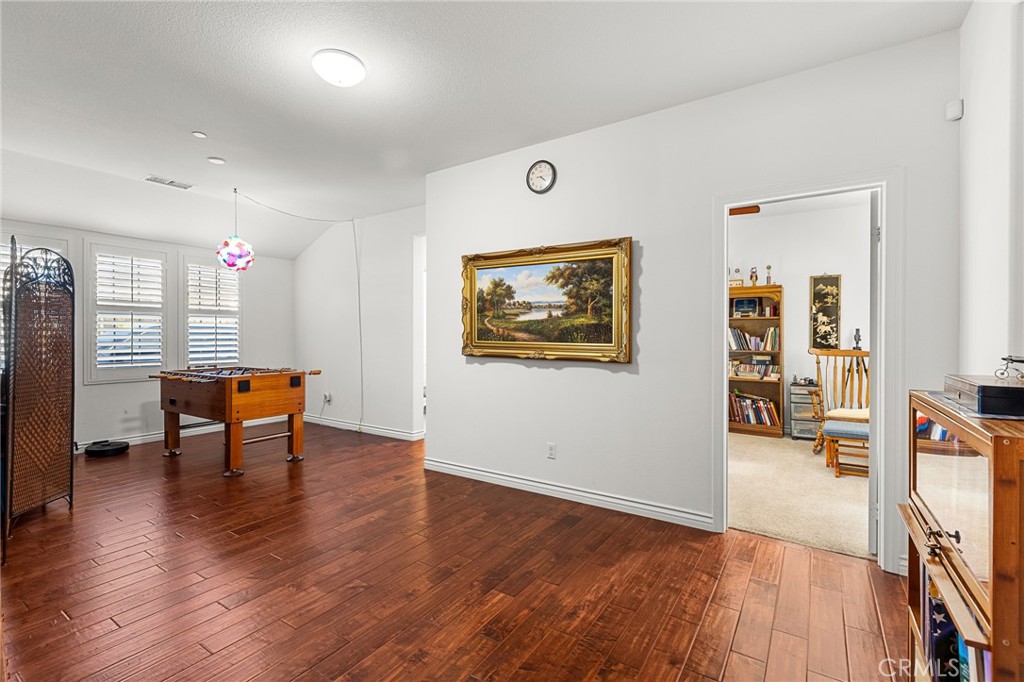 1575 North Grove Street Redlands, CA 92374 - Photo 24 of 45 a view of a room with furniture and wooden floor