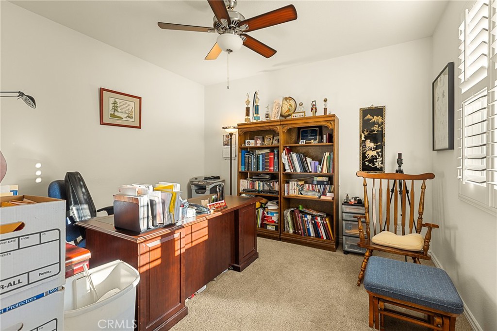 1575 North Grove Street Redlands, CA 92374 - Photo 29 of 45 a workspace with furniture and book shelf