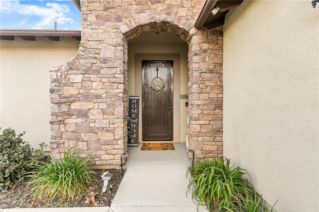 1575 North Grove Street Redlands, CA 92374 - Photo 3 of 45 a front view of a house with a small yard
