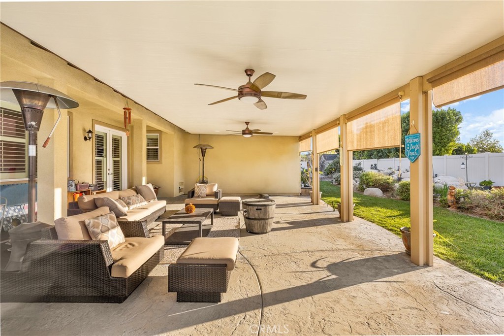 1575 North Grove Street Redlands, CA 92374 - Photo 34 of 45 a living room with patio furniture and a floor to ceiling window