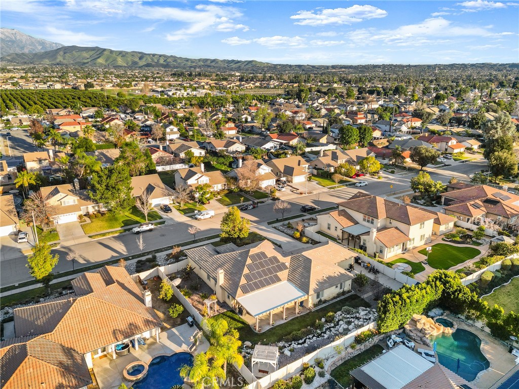 1575 North Grove Street Redlands, CA 92374 - Photo 43 of 45 an aerial view of residential building with parking space