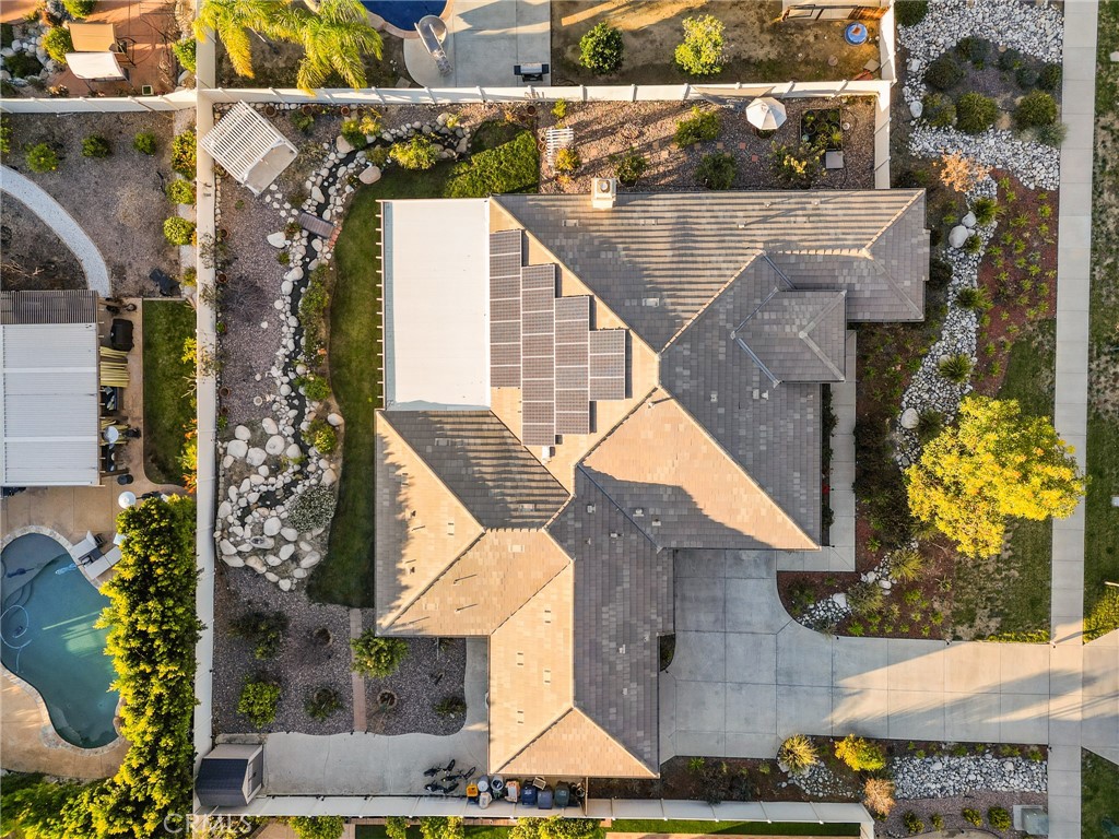 1575 North Grove Street Redlands, CA 92374 - Photo 7 of 45 an aerial view of a house with a yard and a large tree