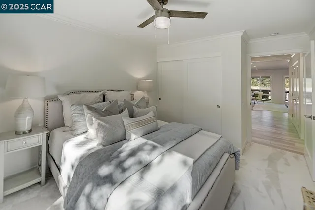 a bathroom with a granite countertop sink mirror vanity and toilet