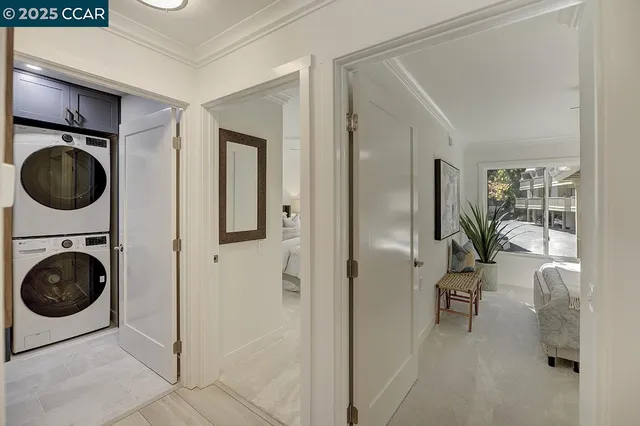 a spacious bedroom with a large bed and a chandelier