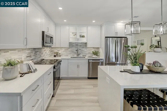 a kitchen with a sink stove and refrigerator
