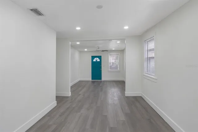 a view of livingroom with hardwood floor and hallway
