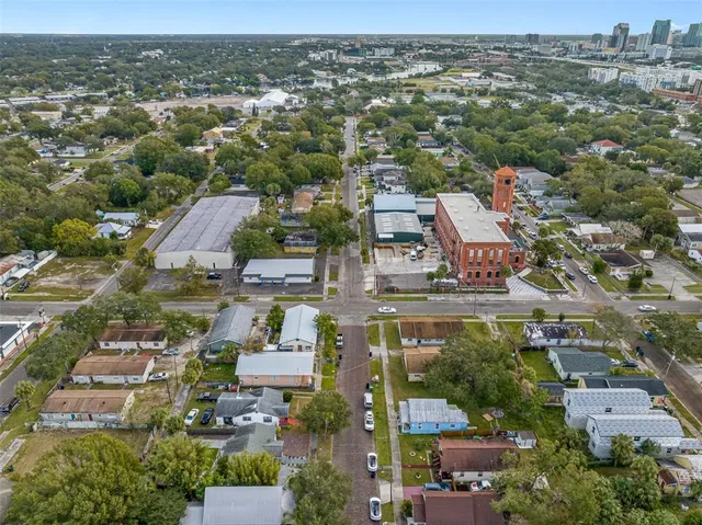 an aerial view of residential houses with outdoor space