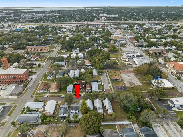 an aerial view of residential houses with outdoor space