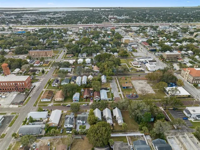 an aerial view of residential houses with city view
