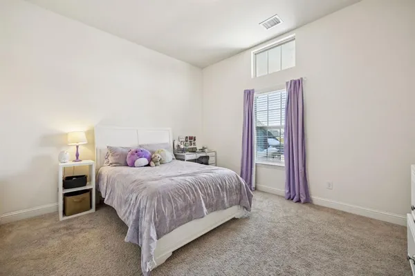 a bedroom with a bed and a closet