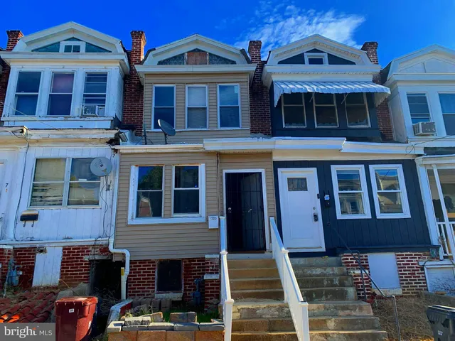a front view of a residential apartment building with windows