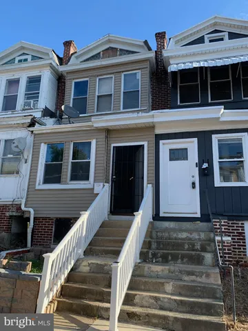 a front view of a house with stairs