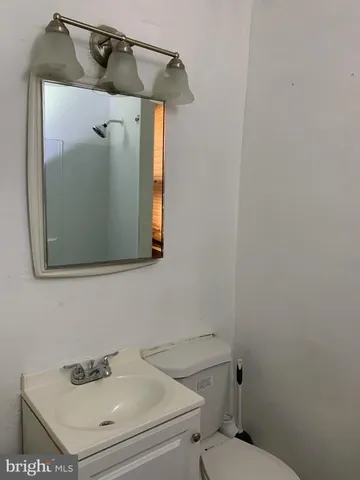 a bathroom with a sink and mirror
