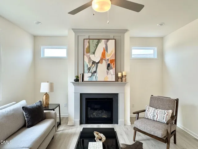 a kitchen with granite countertop a sink a stove and a microwave