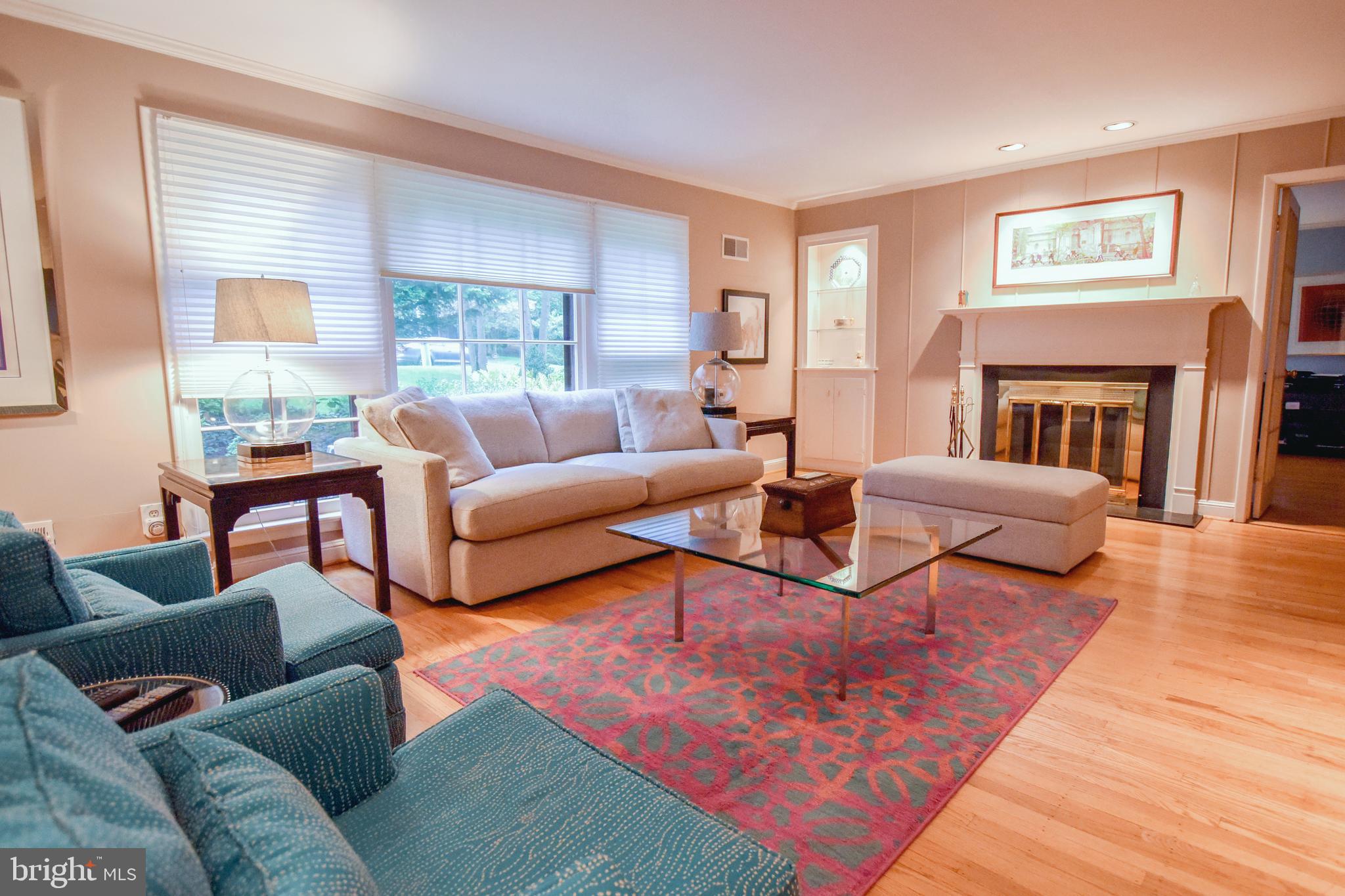 1227 Pinewood Road Villanova, PA 19085 - Photo 15 of 43 a living room with furniture and a fireplace