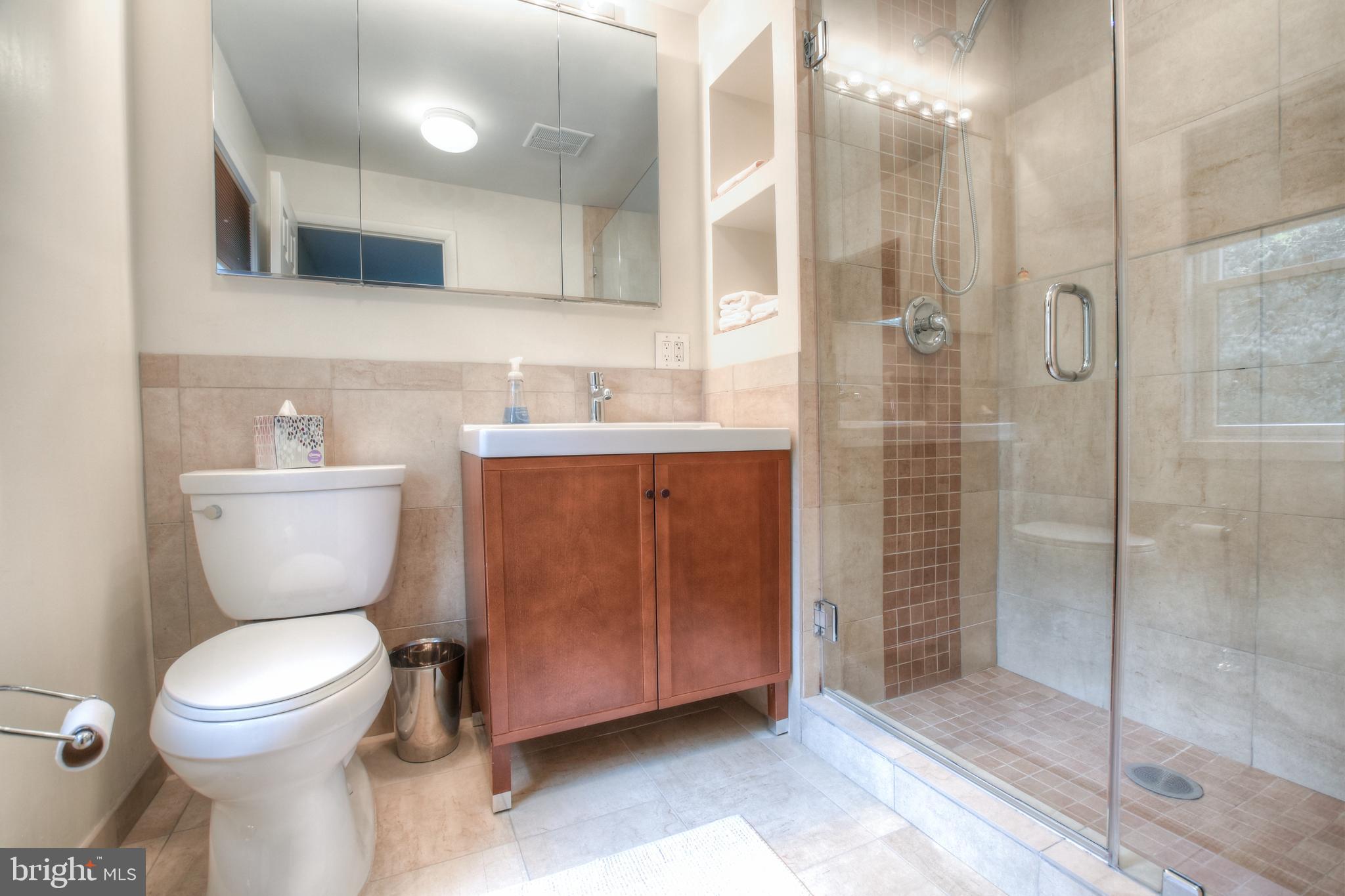 1227 Pinewood Road Villanova, PA 19085 - Photo 22 of 43 a bathroom with a toilet sink and shower