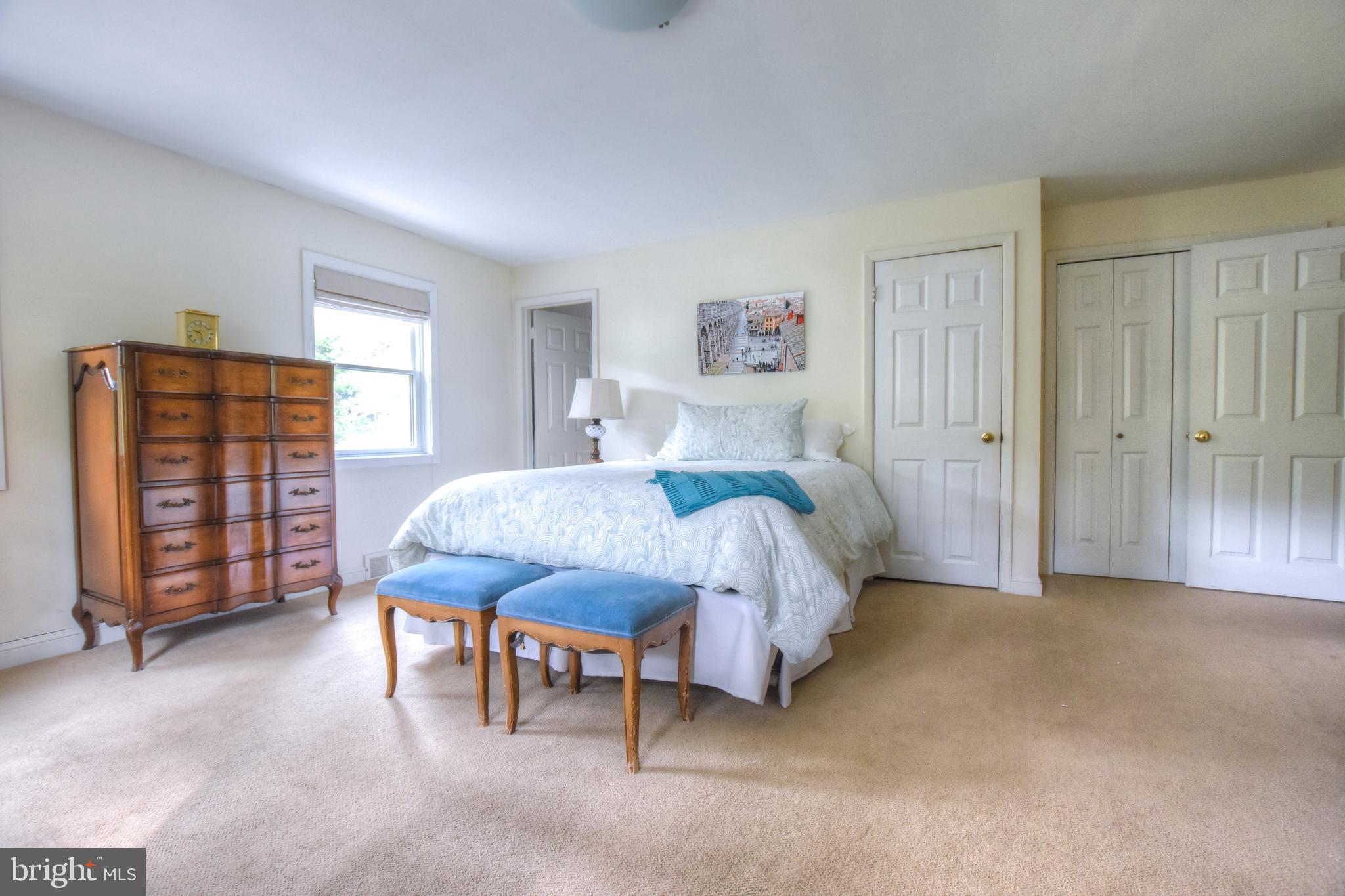 1227 Pinewood Road Villanova, PA 19085 - Photo 24 of 43 a bedroom with a bed a dresser and book shelf