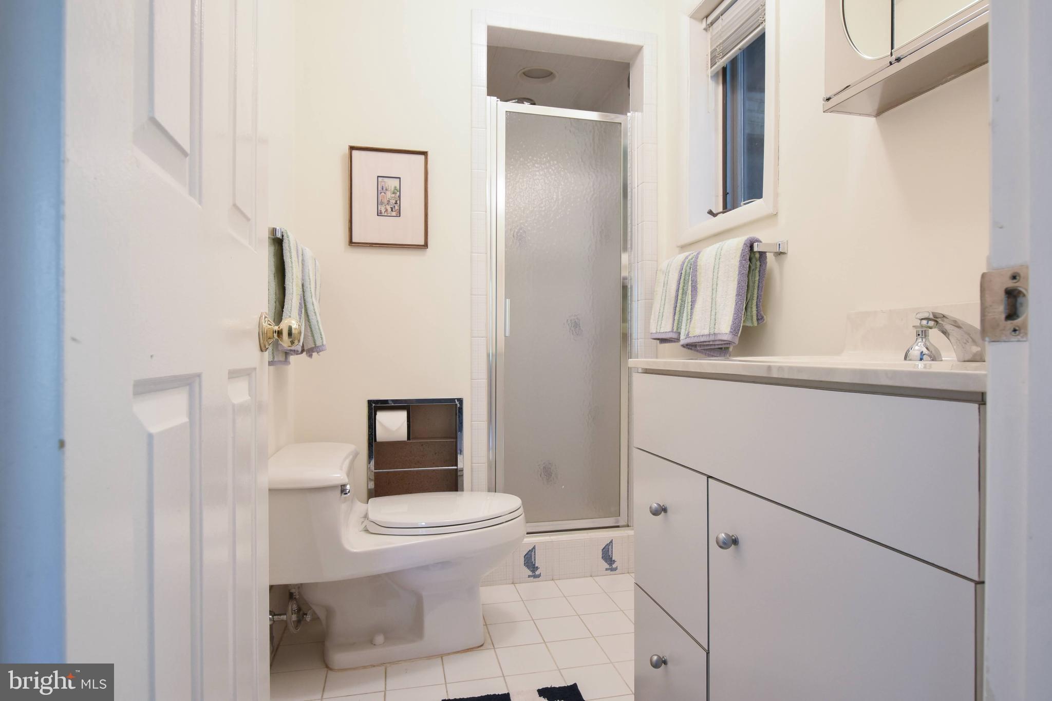 1227 Pinewood Road Villanova, PA 19085 - Photo 25 of 43 a bathroom with a toilet sink and shower