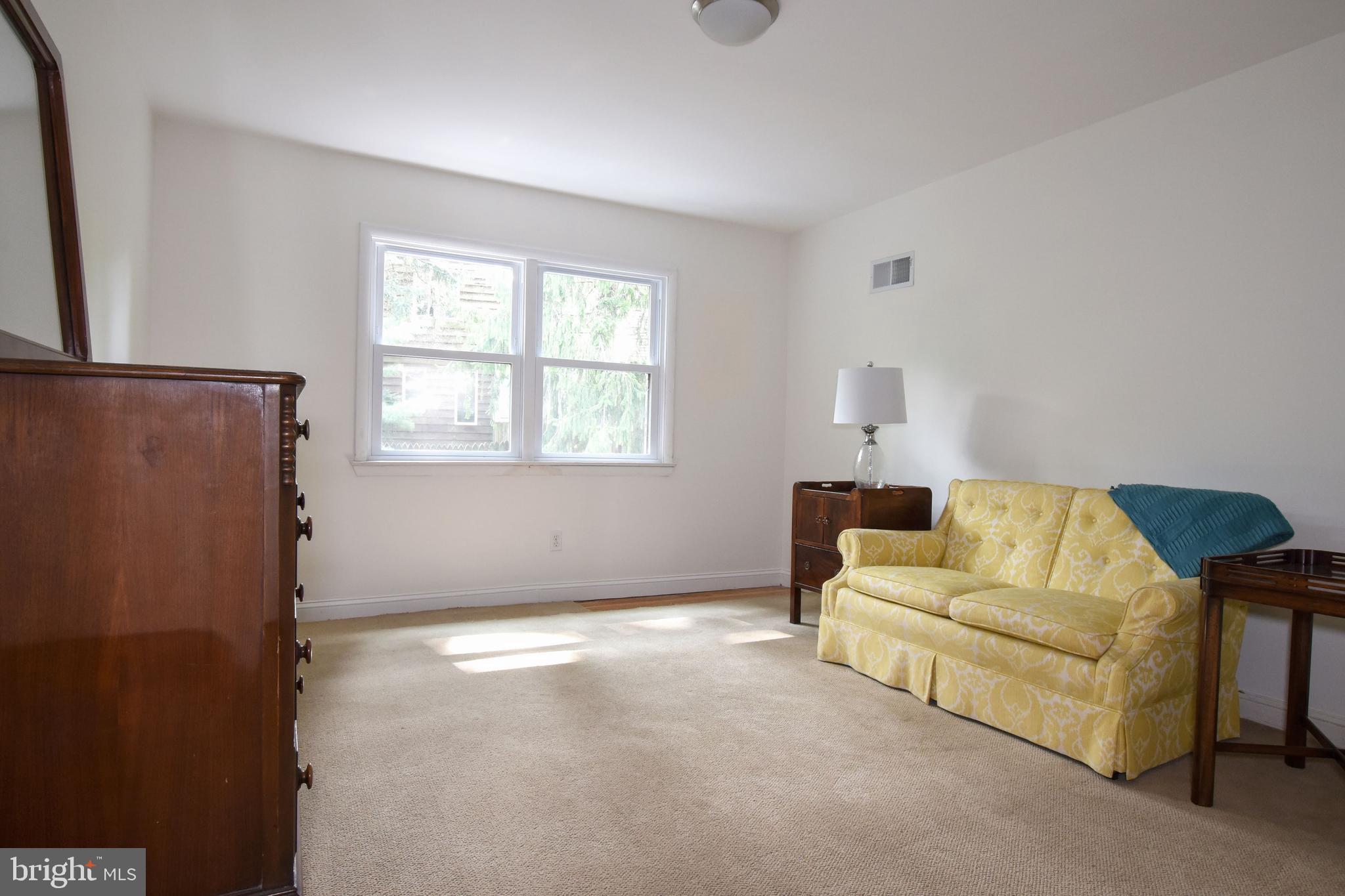 1227 Pinewood Road Villanova, PA 19085 - Photo 27 of 43 a living room with furniture and a window