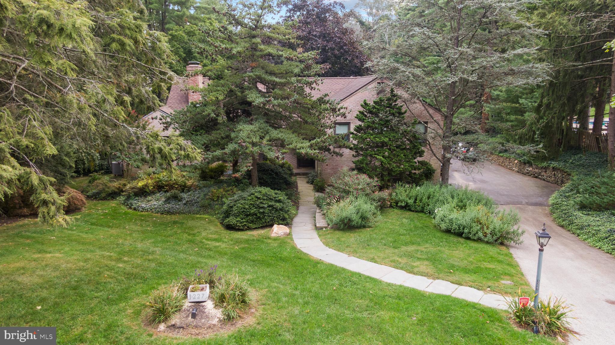1227 Pinewood Road Villanova, PA 19085 - Photo 35 of 43 a view of a garden with an outdoor space
