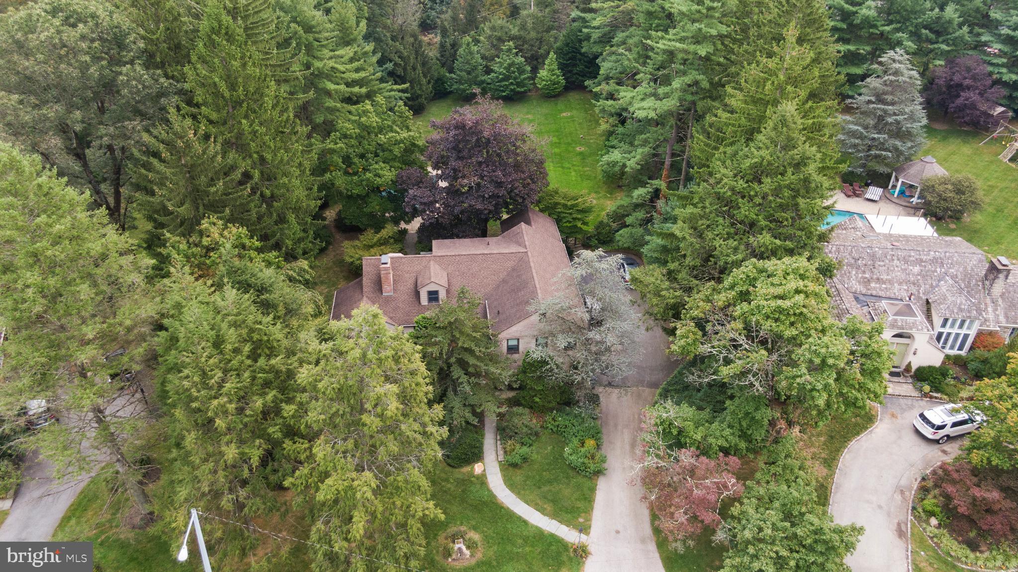 1227 Pinewood Road Villanova, PA 19085 - Photo 36 of 43 an aerial view of a house with a yard and lake view