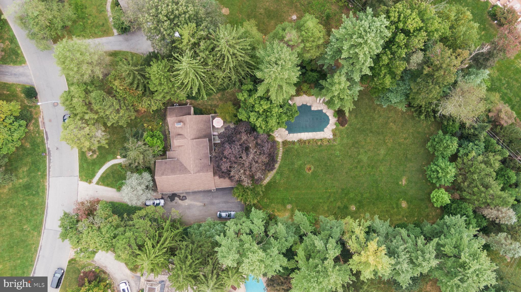1227 Pinewood Road Villanova, PA 19085 - Photo 37 of 43 an aerial view of a house with a yard and trees all around