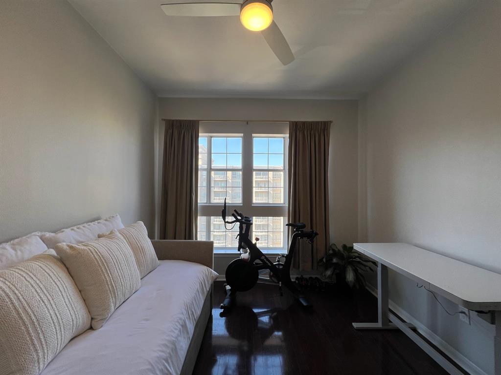3225 Turtle Creek Boulevard, Unit 1706 Dallas, TX 75219 - Photo 9 of 13 a living room with furniture and a window