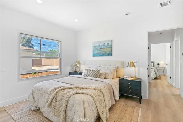 a bedroom with a bed and a couch