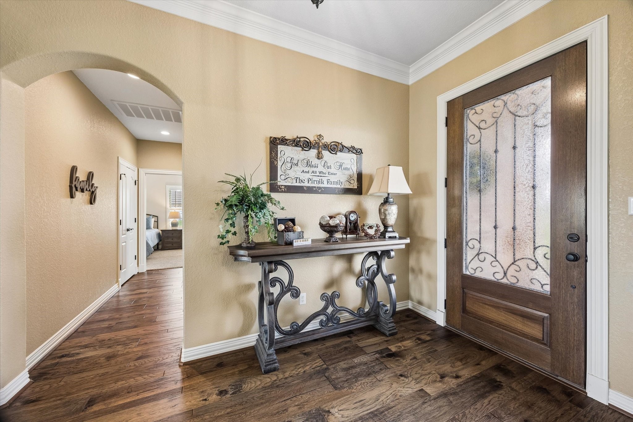 17703 Cedarhill Drive Rosharon, TX 77583 - Photo 6 of 47 A grand first impression awaits with rich hardwood floors, soaring crown molding, and an elegant iron-glass front door.