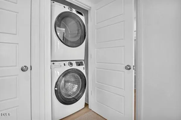 a view of a storage and utility room with washer and dryer