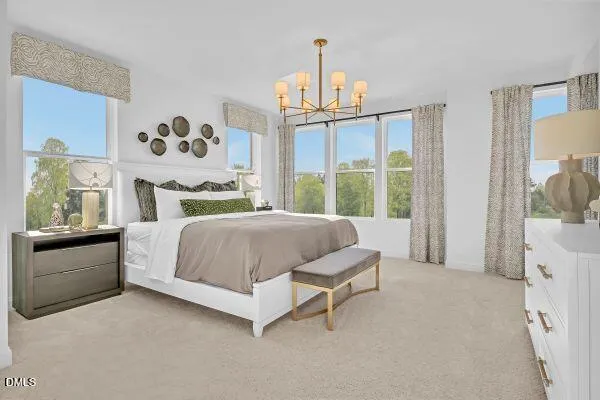 a spacious bedroom with a bed and a window