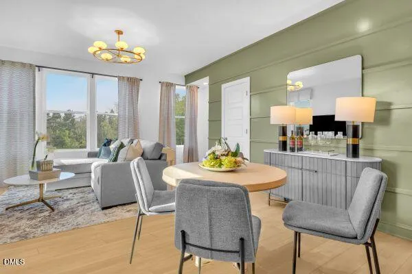 a view of a dining room with furniture and a large window