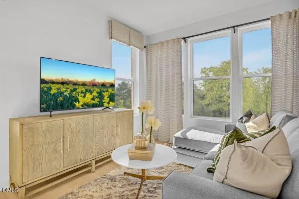 a living room with furniture and a large window