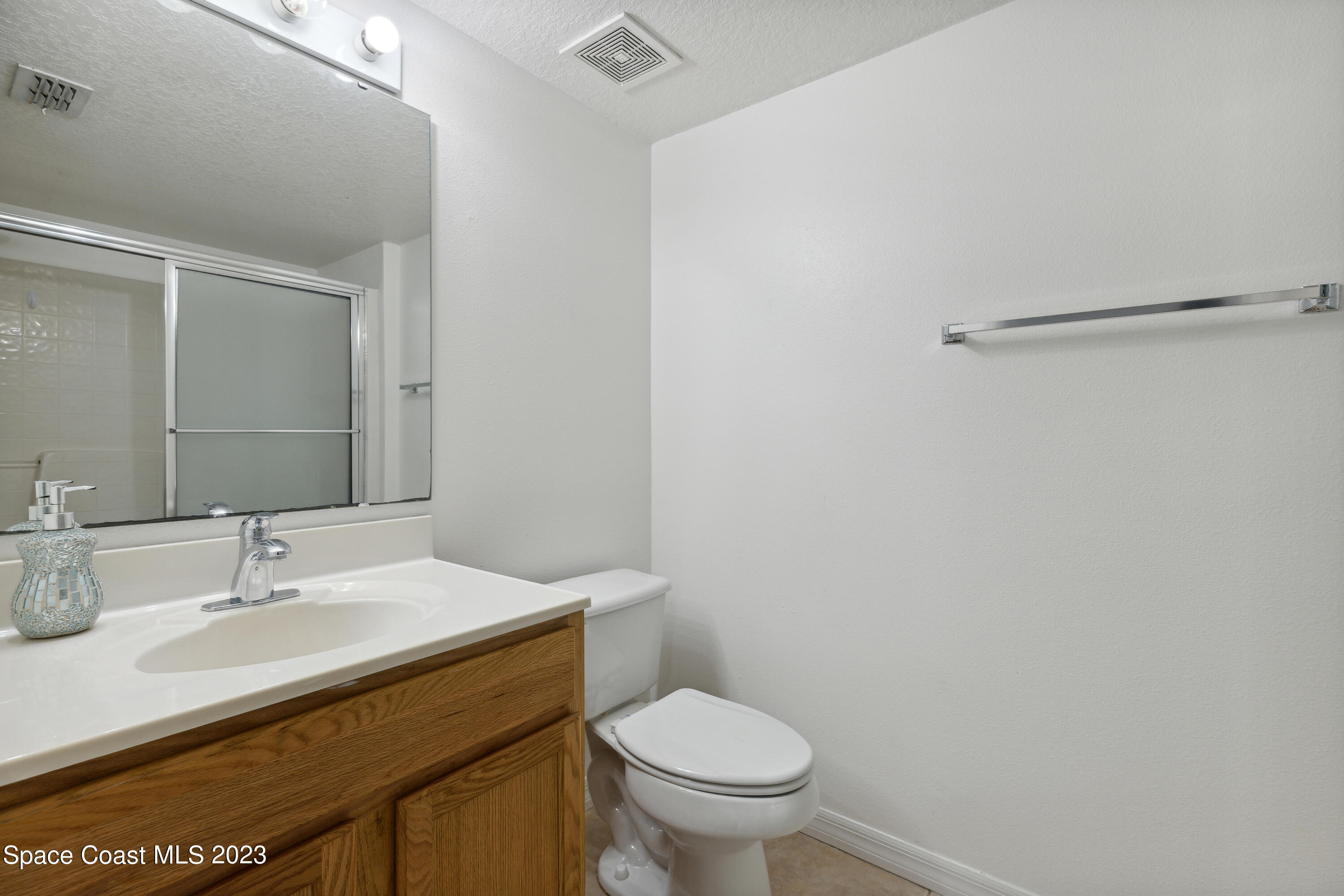 4625 Elena Way Melbourne, FL 32934 - Photo 12 of 26 a bathroom with a sink and a toilet