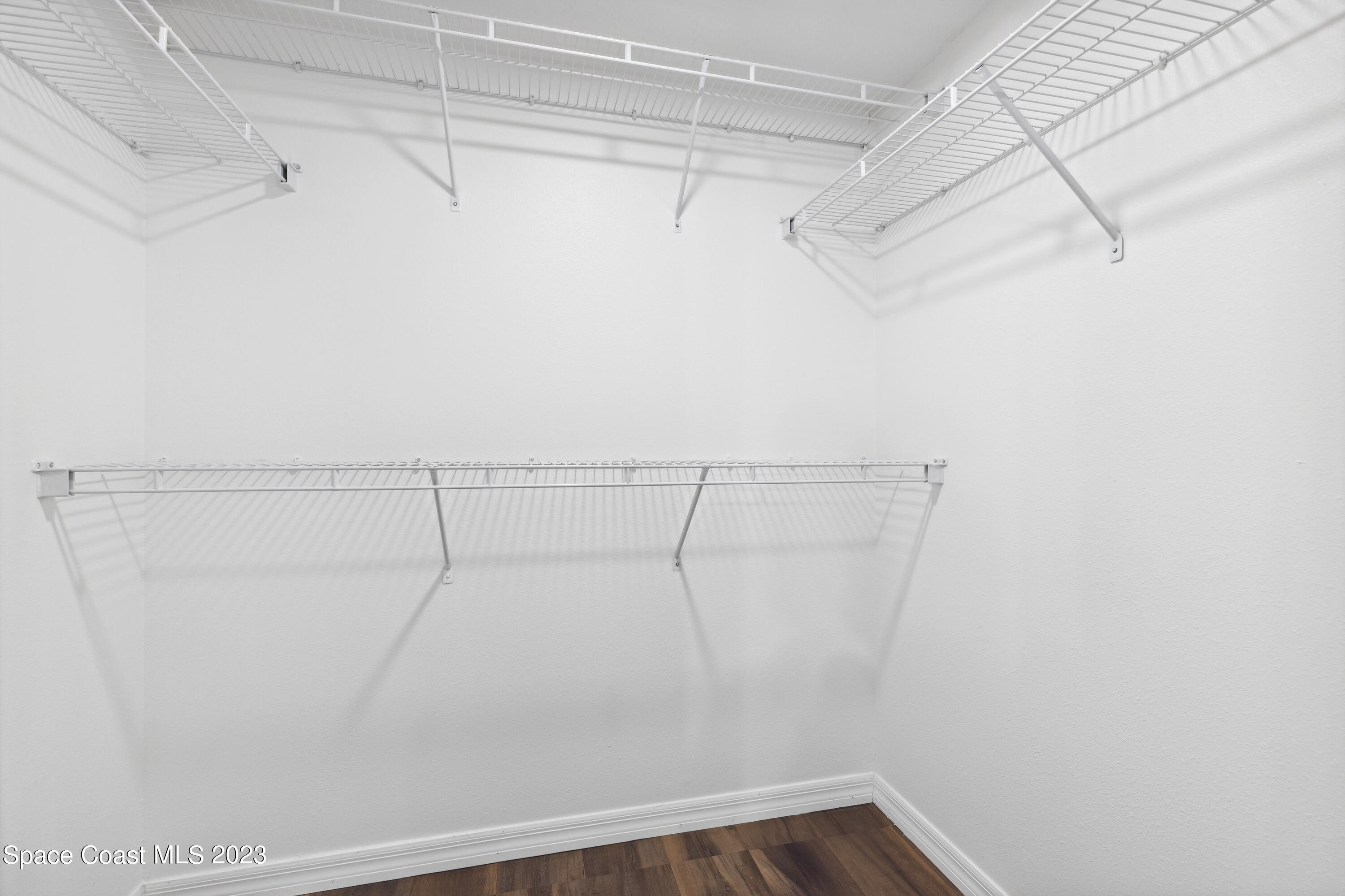 4625 Elena Way Melbourne, FL 32934 - Photo 13 of 26 a view of a room with racks on the wall
