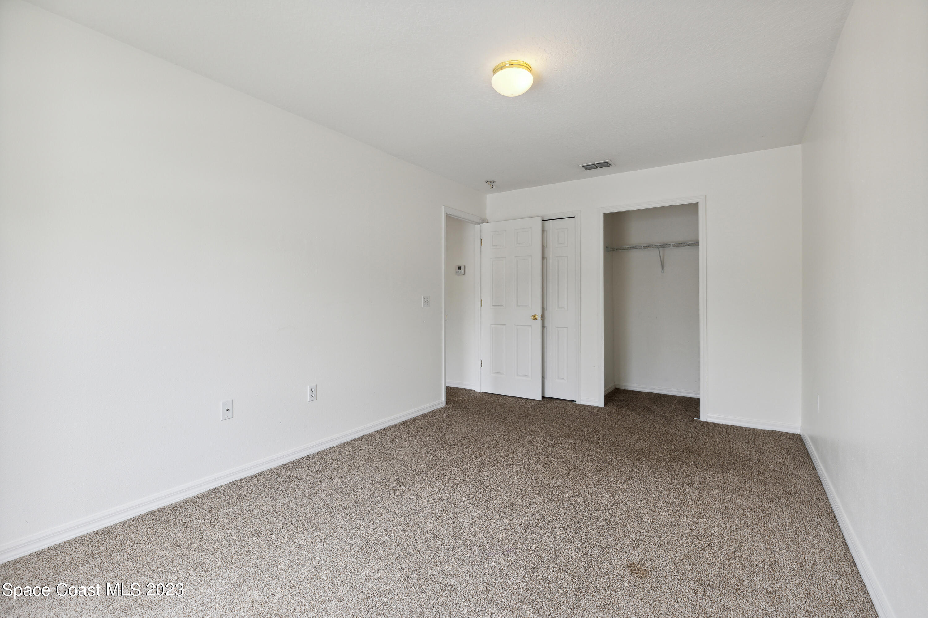 4625 Elena Way Melbourne, FL 32934 - Photo 17 of 26 a view of an empty room