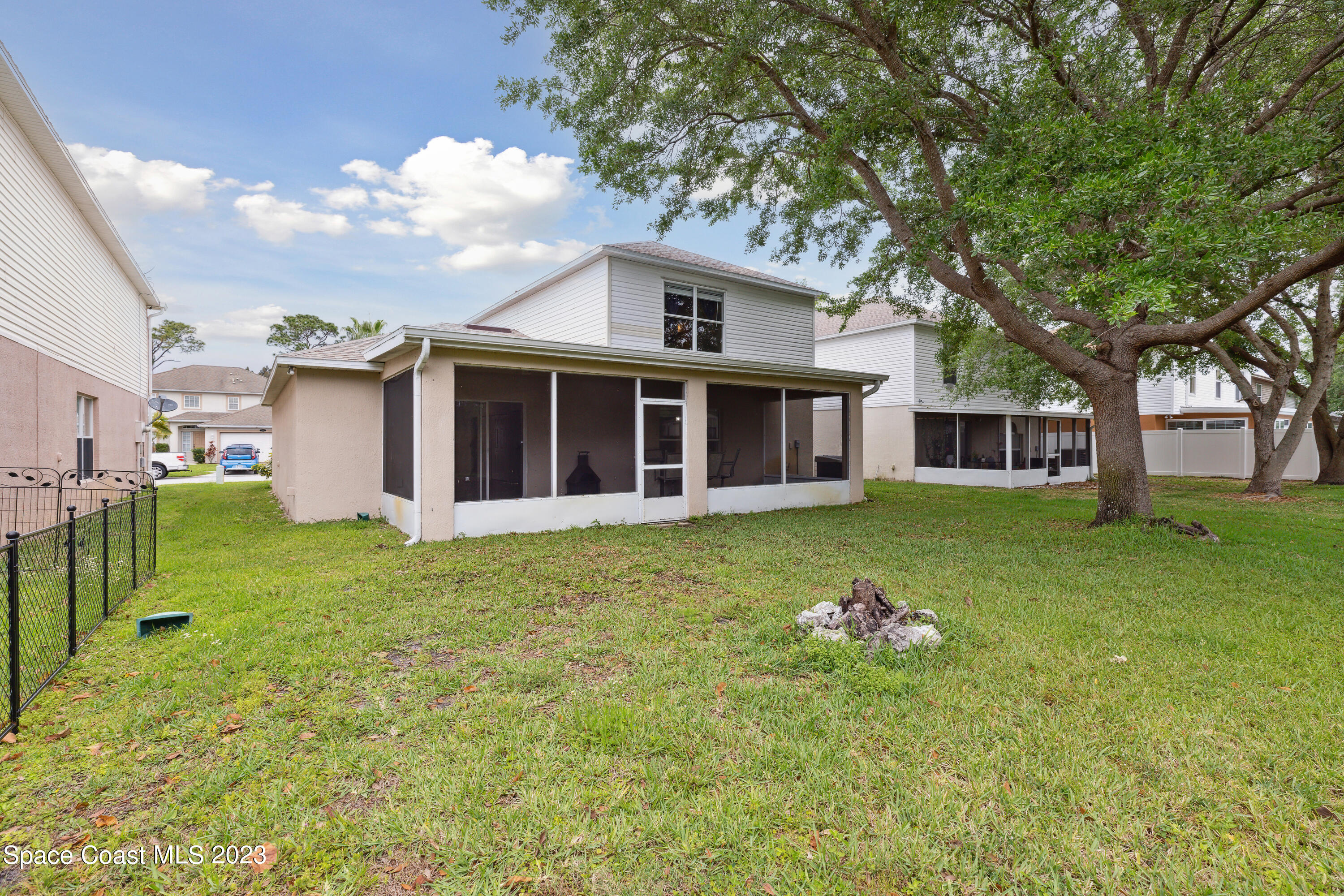 4625 Elena Way Melbourne, FL 32934 - Photo 20 of 26 a front view of a house with a garden
