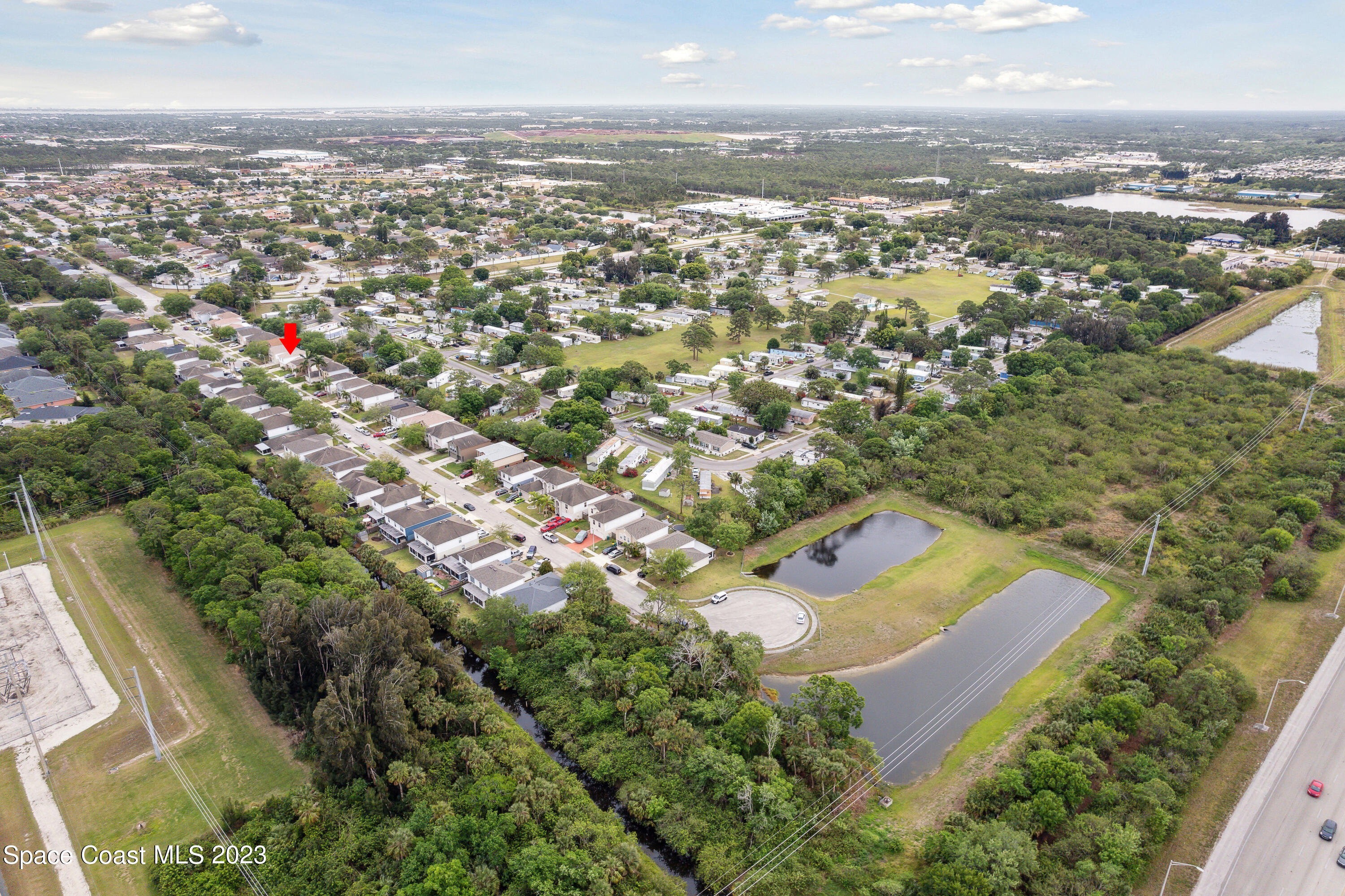 4625 Elena Way Melbourne, FL 32934 - Photo 25 of 26 an aerial view of residential houses with outdoor space