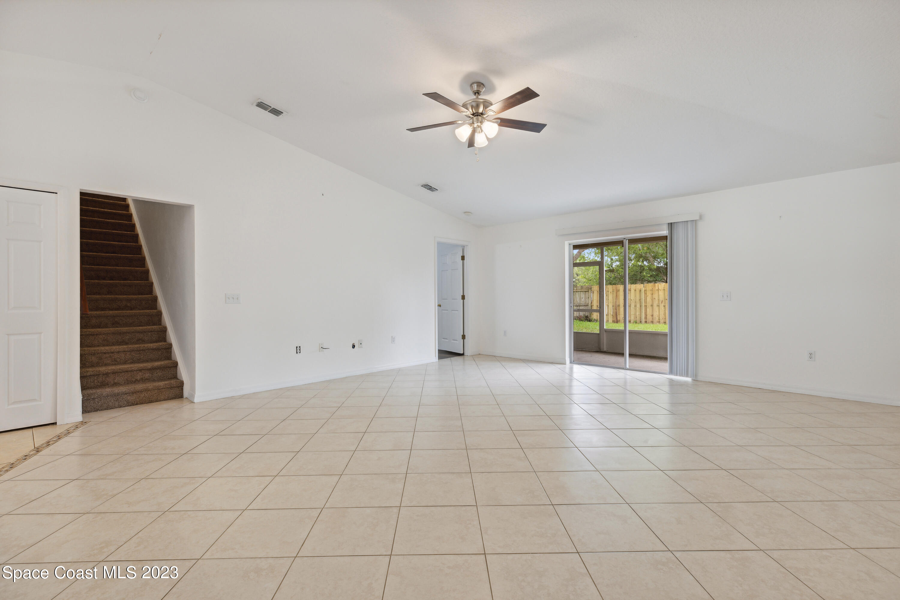 4625 Elena Way Melbourne, FL 32934 - Photo 8 of 26 a view of an empty room with a window