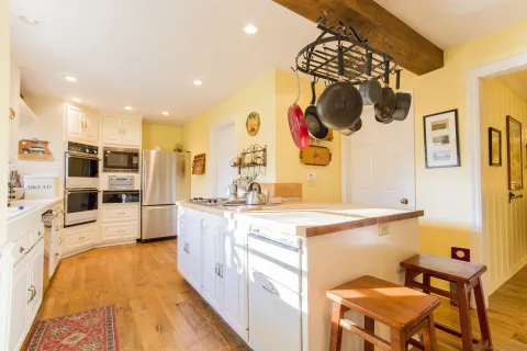 a kitchen with stainless steel appliances granite countertop a sink and cabinets