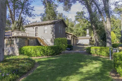 a front view of a house with garden