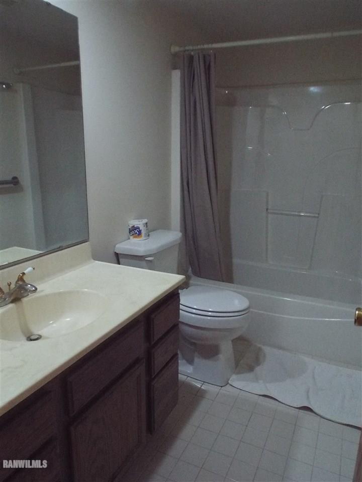 10110 Getz Road Mount Carroll, IL 61053 - Photo 12 of 18 a bathroom with a sink a toilet and shower