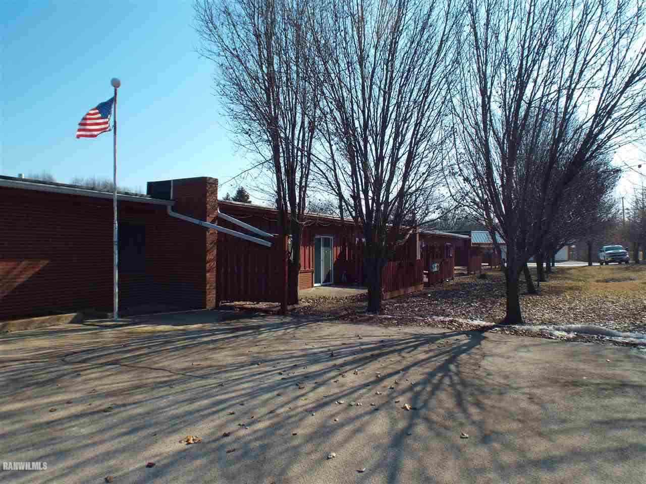 10110 Getz Road Mount Carroll, IL 61053 - Photo 15 of 18 a front view of a house with a yard
