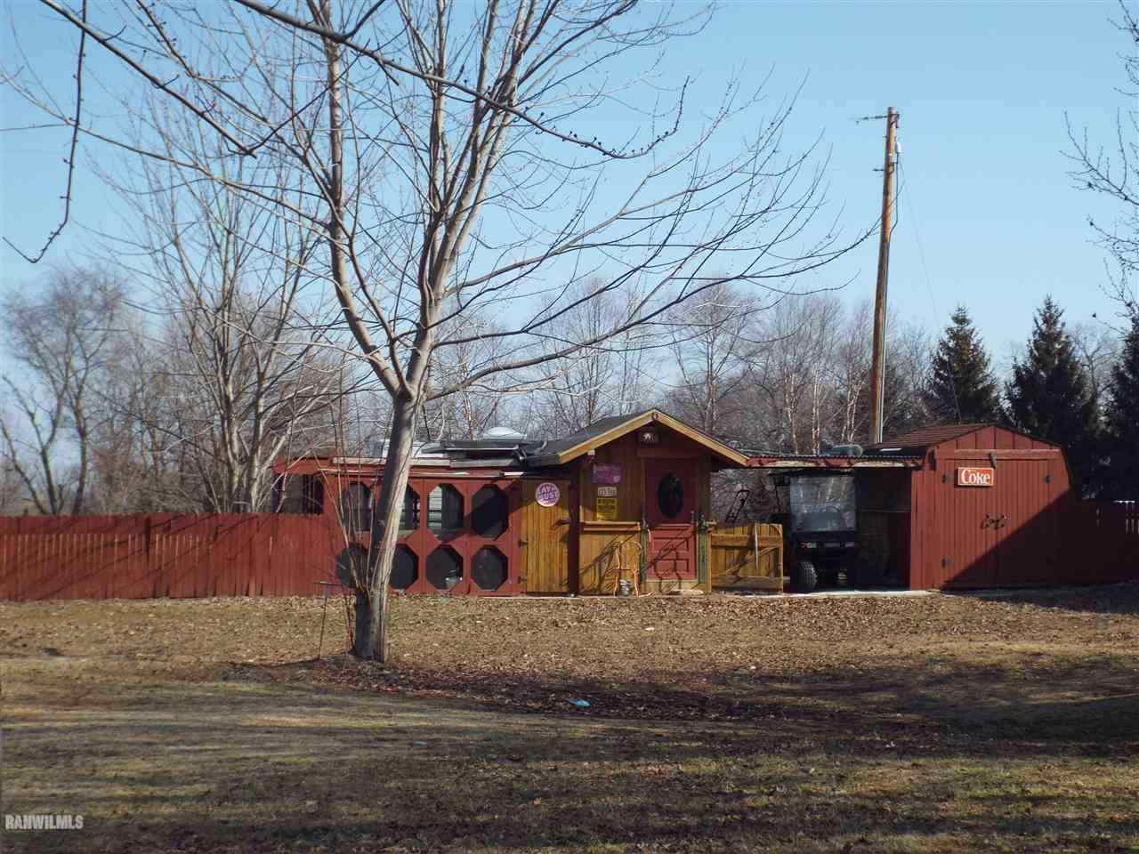 10110 Getz Road Mount Carroll, IL 61053 - Photo 16 of 18 a view of street with wooden fence